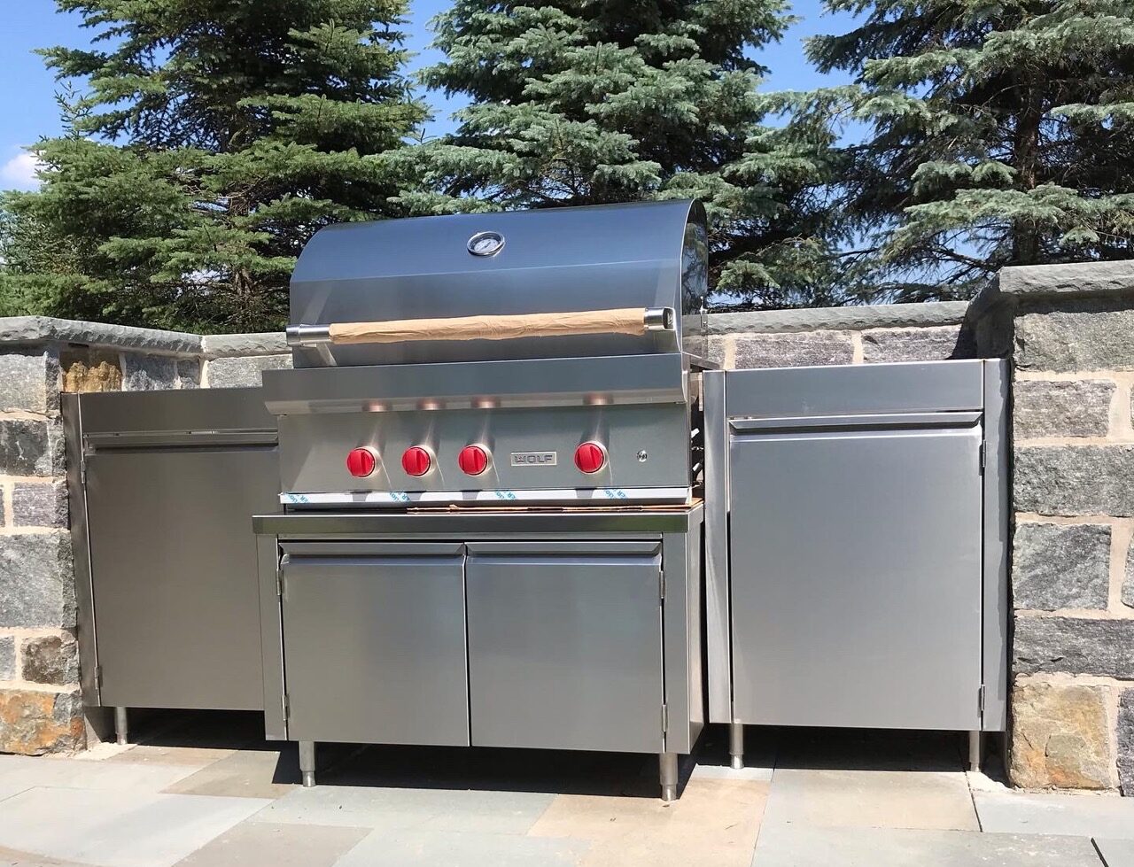 Stainless steel built-in outdoor kitchen.