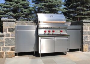 Stainless steel built-in outdoor kitchen.