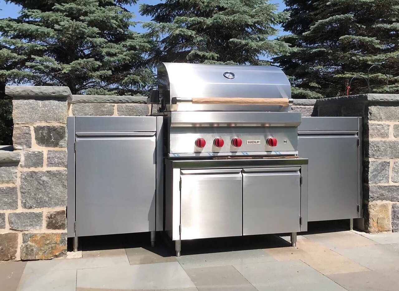 Stainless steel built-in outdoor kitchen.