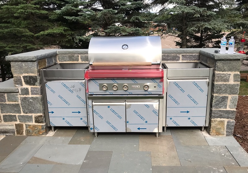 Stainless steel built-in outdoor kitchen.